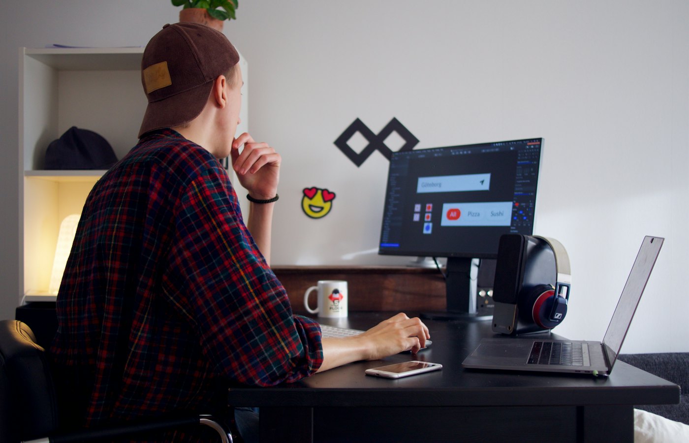 Freelance graphic designer working on a brand project at a desk