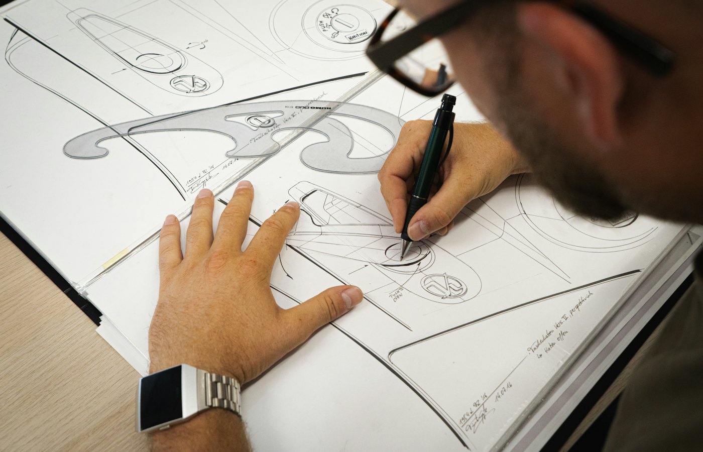 Designer sketching logo concepts by hand